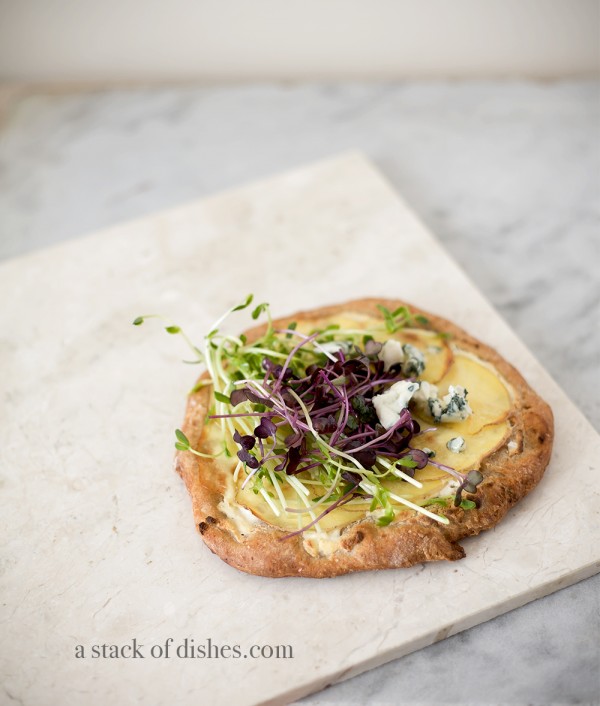 potato pizza, a stack of dishes