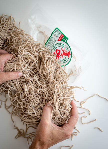 Preparing fresh soba noodles- A Stack of Dishes