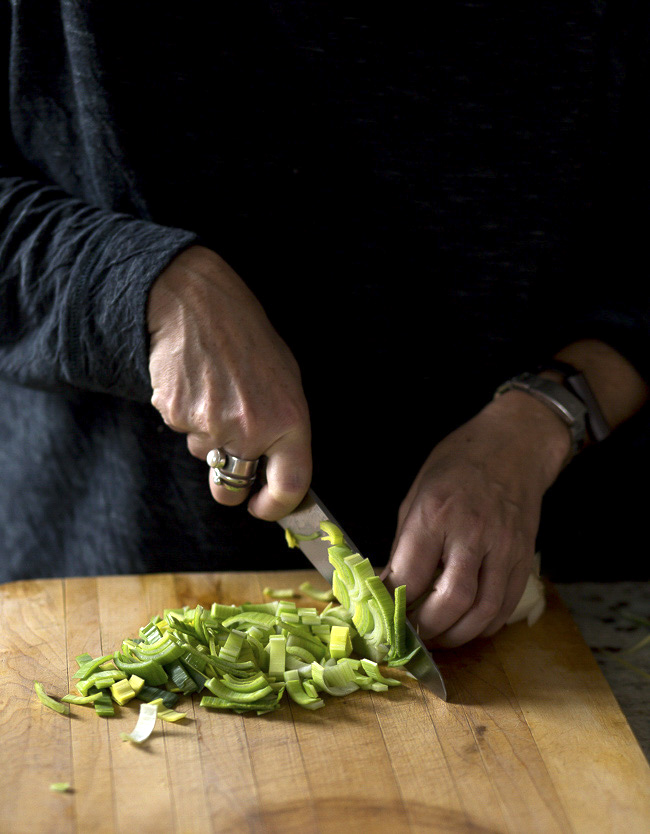 Slicing leeks to be charred- A Stack of Dishes