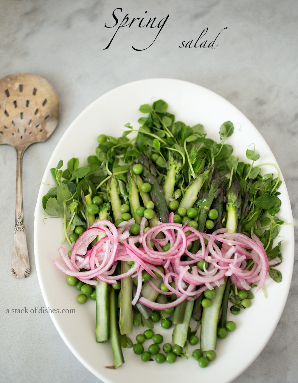 asparagus and garden pea salad, spring greens, spring vegetables, a stack of dishes