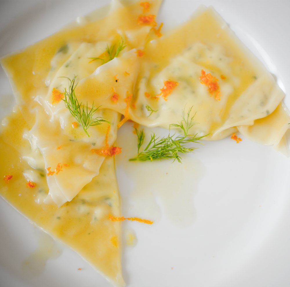 Goat Cheese Raviolo- A Stack of Dishes